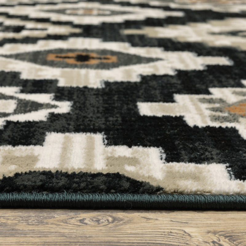 6' X 9' Black Grey Tan Orange And Ivory Southwestern Power Loom Stain Resistant Area Rug